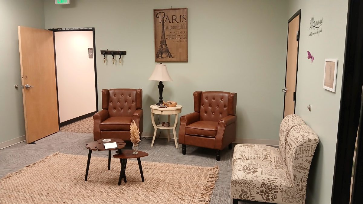 Waiting room with leather armchairs and a woven rug